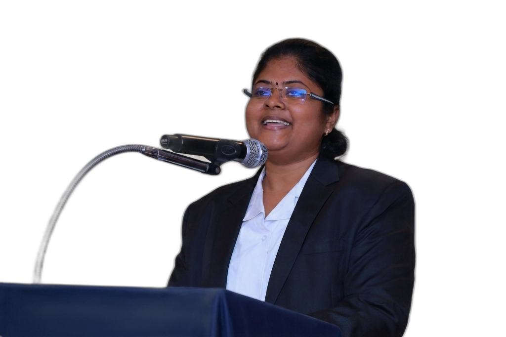 Nithya R delivering keynote speech on stage